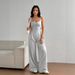 G25J090 2025 European And American High End Women's Clothing Solid Color Fashion Slightly Flared Trousers Backless Suspender Casual Jumpsuit Women's Pants_ecoleips.com