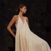 2024 Cross-Border Summer European Women's Loose Solid Color Ruched Irregular Beach Strap Long Dress_ecoleips.com
