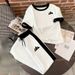 Women's Clothing Women's Summer Casual T-Shirt And Sweatpants Set Loose Fitting Short Sleeved Triangle Print Style Clothing_ecoleips.com