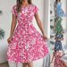 Real Shot Of 2026 Spring/Summer European And American Elegant Floral Short-sleeve Pleated Dress With A Large Hem._ecoleips.com