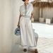 Summer Minimalist Resort Style Short Sleeve Top And Black Trimmed Wide Leg Pants Set Products_ecoleips.com