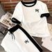 Fashion Women's Casual Two Piece Set Short Sleeved Top And Loose Fitting Trousers 8002 Print Cross Border_ecoleips.com