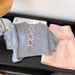 ng2510292 Shenzhen Nanyou High-Quality Women's Clothing: Lightweight Knit Short-Sleeve T-Shirt With Intricate Back Cutout And Bow_ecoleips.com