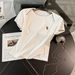 Women's Summer New Fashion Sports Leisure Suit Western Style Slim Round Neck Short Sleeved Top Pleated Pants Skirt Two Piece Suit_ecoleips.com