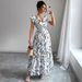 2025 Women Elegant Fashion Charming Vacation Beach Party Lace-Up Ruffle Hem Short Sleeve A-Line Dress Floral Print_ecoleips.com