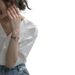 A Chic Yet Understated White Shirt For Women, Featuring A Cool-Toned Design With A Vintage French-Inspired Look, Perfect_ecoleips.com