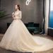 Champagne Lace Long Sleeve Wedding Dress With Cathedral Train, Plus Size Bridal Gown For Elegant Bride, Flowy A-Line Silhouette_ecoleips.com