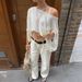 European And American Vacation Style Fashion Shawl Long-sleeved Top T-shirt Women's Clothing 2026 Summer_ecoleips.com