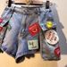 European Station 2025 Summer New Embroidered Letter Logo Patch High-Waisted Slimming Cargo Pocket Denim Shorts For Women_ecoleips.com