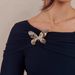 2026 Spring New Off-Shoulder Butterfly Brooch Design Slim Fit Long Sleeve Women's Top From Cross-Border_ecoleips.com