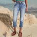 European And American INS Fashion Simple Pocket Hip-Lifting High Elasticity Denim Ripped Capri Pants For Women_ecoleips.com