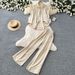 Relaxed And Stylish Two Piece Set For Women, Featuring A Striped Shirt And Wide Leg Pants With Rhinestone Embellishments, Perfect For Spring And Autumn Commuting And Casual Wear._ecoleips.com