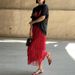 2025 Spring New Korean Style Tassel Fashion Versatile Elastic Waist Solid Color Patchwork Pleated Skirt For Women_ecoleips.com
