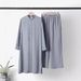 2025 New Muslim Women's Two-Piece Set Fashionable Elegant Solid Color Irregular Long Shirt Top Wide-Leg Pants_ecoleips.com