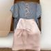 ng2510292 Shenzhen Nanyou High-Quality Women's Clothing: Lightweight Knit Short-Sleeve T-Shirt With Intricate Back Cutout And Bow_ecoleips.com