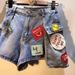 European Station 2025 Summer New Embroidered Letter Logo Patch High-Waisted Slimming Cargo Pocket Denim Shorts For Women_ecoleips.com
