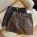 ng2510292 Trendy Leather-effect A-line For Women, 2025 Autumn New Style, Plus-size Slimming Short Skirt In Coffee Color_ecoleips.com