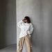 Casual European And American Women's Clothing Solid Color Round Neck Long-sleeved Top Loose Hem Rough Edge Decorative Sweater_ecoleips.com