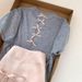 ng2510292 Shenzhen Nanyou High-Quality Women's Clothing: Lightweight Knit Short-Sleeve T-Shirt With Intricate Back Cutout And Bow_ecoleips.com