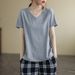 The Korean-Style Loose Top Is A Trendy Summer Short-Sleeved Garment With A V-Neck Design, Featuring Stylish Labels And P_ecoleips.com