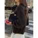 A Casual Yet Elegant Long-Sleeved Jacket With Simple Buttons, Paired With A Relaxed Yet Stylish Sweater In A Retro-Chic_ecoleips.com